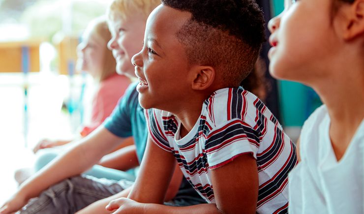 Group of smiling children in a classroom